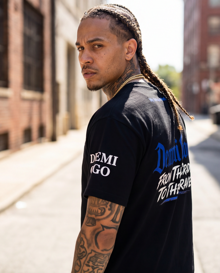 Side profile view of the black XL heavyweight 7oz t-shirt highlighting the relaxed, boxy streetwear silhouette and sleeve drape.