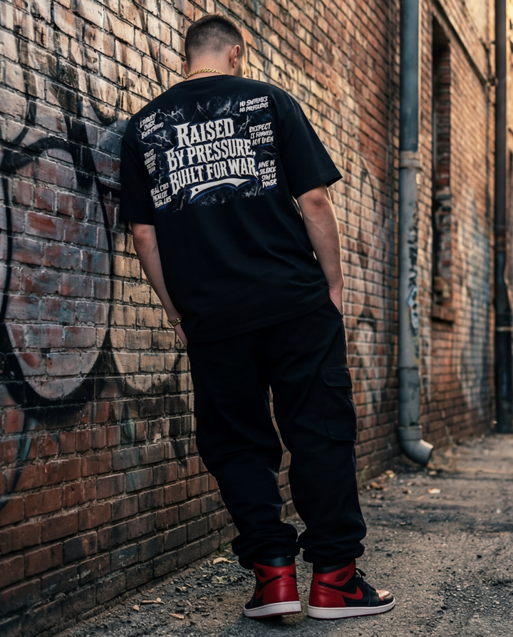Back view of the solid black, premium 7oz streetwear t-shirt showing the clean neckline and heavyweight structure.