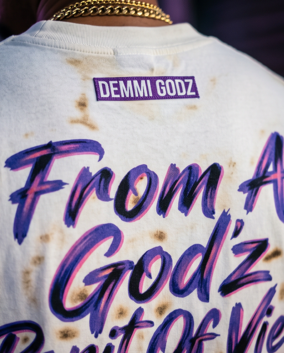 Detailed close-up of the back of the Off-White streetwear tee, focusing on the unique fabric texture, custom edge distressing, and precision burn marks.