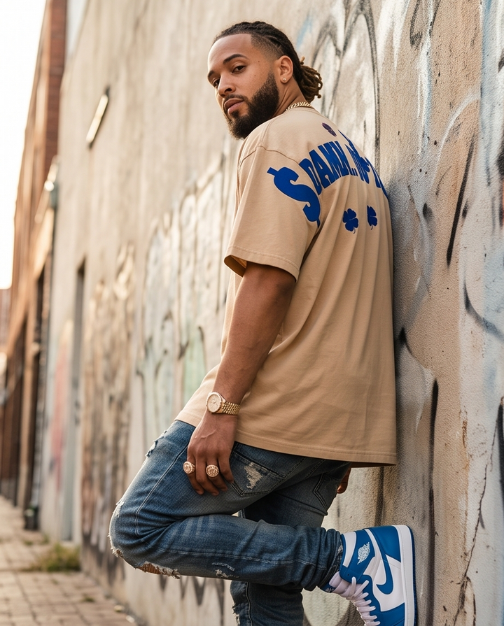 Side profile view of the size XL one-of-a-kind graphic tee, showing the boxy, oversized silhouette and medium-length cropped hem.