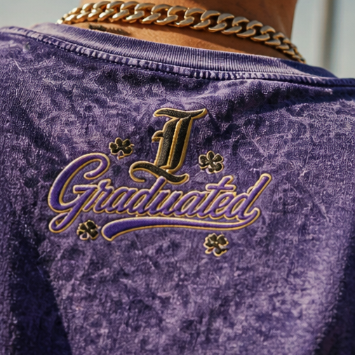 Close-up view of the back of the Demmi Godz purple vintage washed t-shirt showing the fabric texture and rear neckline stitching details.