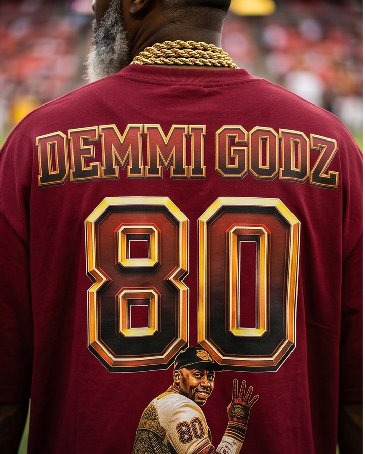 Close-up detail of distressed collar and fabric texture on back of burgundy Jerry Rice graphic t-shirt.